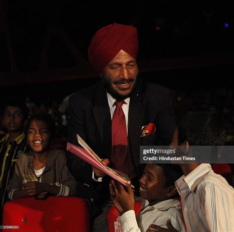 Former athlete Milkha Singh interacts with children fighting against ...