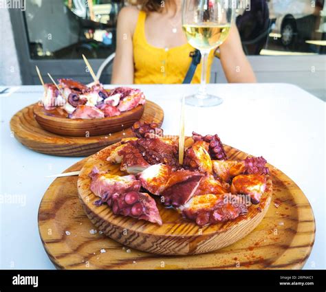 Woman Eating Pulpo A La Gallega With Potatoes Galician Octopus Dishes