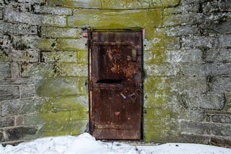 Old Abandoned Metal Door With Rust In Castle Wall Photo Background And