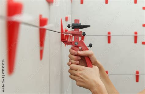 Woman Tiling Bathroom Walls Flat Wall Plastic Tile Leveling System