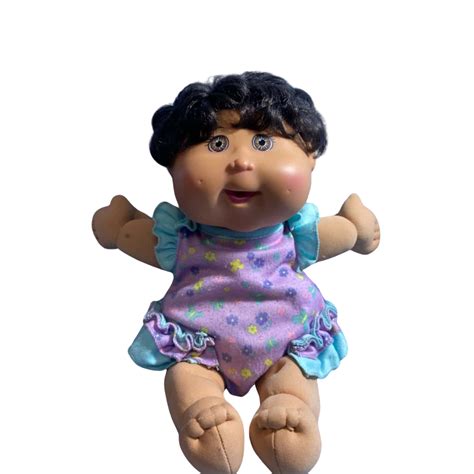 Cabbage Patch Doll With Purple And Blue Dress