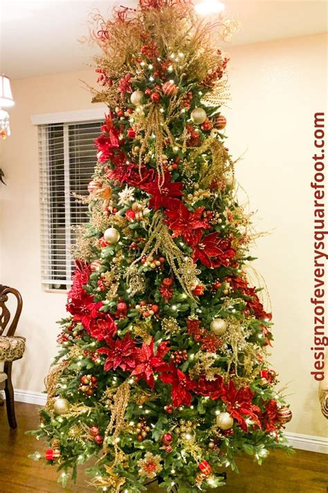 A Decorated Christmas Tree With Red And Gold Decorations