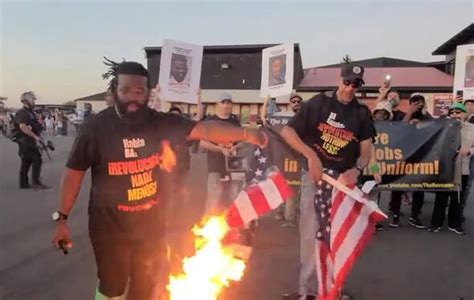 Communist revolutionaries burn and stomp on American flags in protest ...