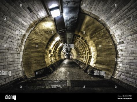 Two shadowy figures in the Greenwich foot tunnel. Are they eerie spirits in a tunnel that ...