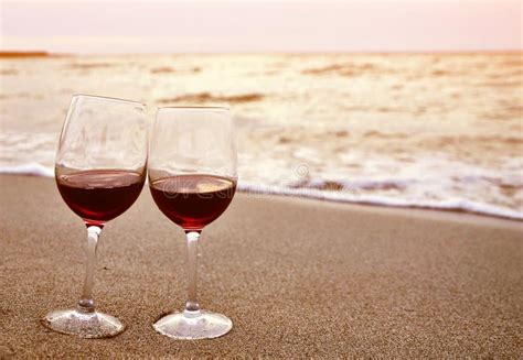 Two Wine Glasses With Red Wine On Sand Beach Valentine`s Day Concept Stock Image Image Of