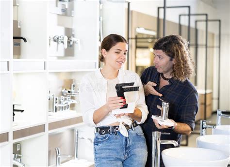 Husband And Wife Are Arguing About Choosing Color Of Bathroom Water