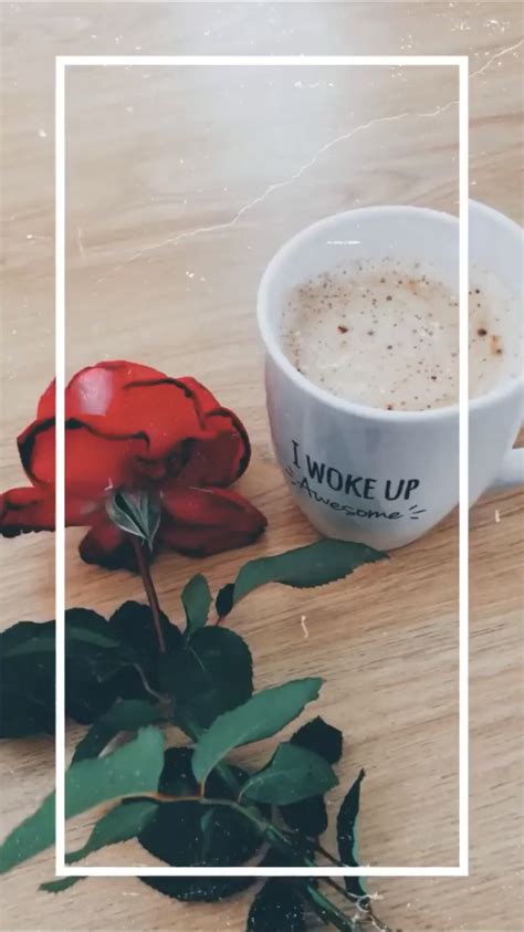 A Cup Of Coffee Next To A Red Rose On A Table With The Words Woke Up