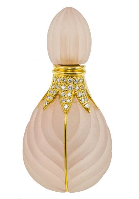 An Image Of A Perfume Bottle With Diamonds On The Top And In The Shape