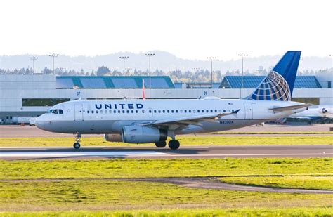 A United Express Flight Ready To Depart Pdx On The Way To Denver The