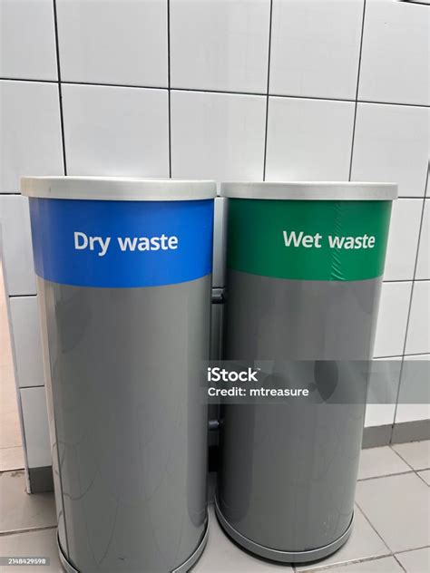 Image Of Cylindrical Plastic Recycling Rubbish Bins Labelled For