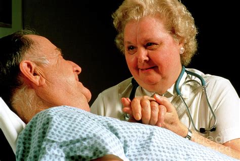 Geriatric Care Elderly Man Reassured By Nurse Photograph By John Greim