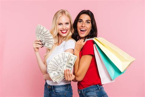 Free Photo Two Cheerful Women Covering Their Half Faces And Looking At The Camera With Open