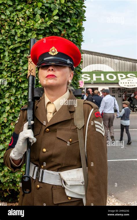 Female in vintage, period Military Police army costume with gun at the ...