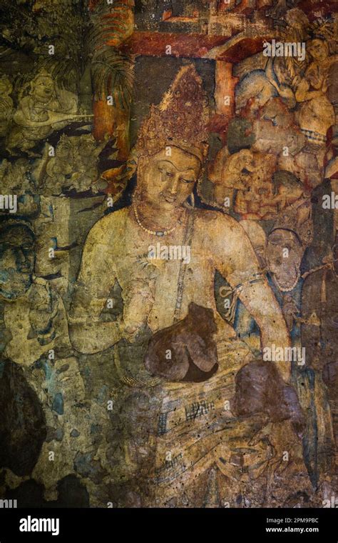 The 5th-century Bodhisattva Padmapani painting depicting the Buddha holding a lotus flower at ...