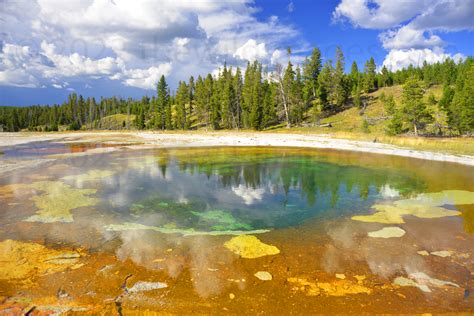 Colors And Sky Reflections Over Beauty Pool In Yellowstone National