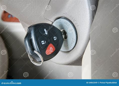 Car Key In Ignition Start Stop Or Accelerate Engine Car Shape Keyfob On Vehicle Dashboard