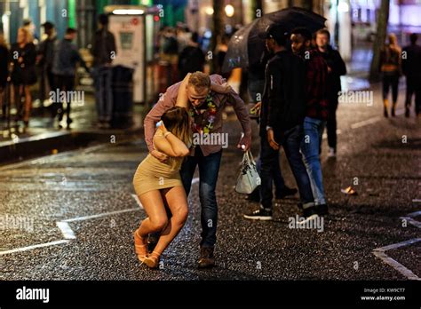 A Woman Is Grabbed By Her Partner Stock Photo Alamy