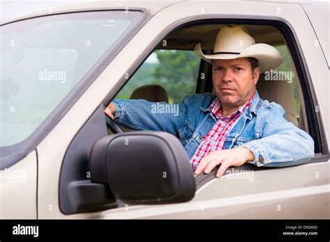 Texas Mature Man With Cowboy Hat Sitting In Pick Up Truck Stock Photo