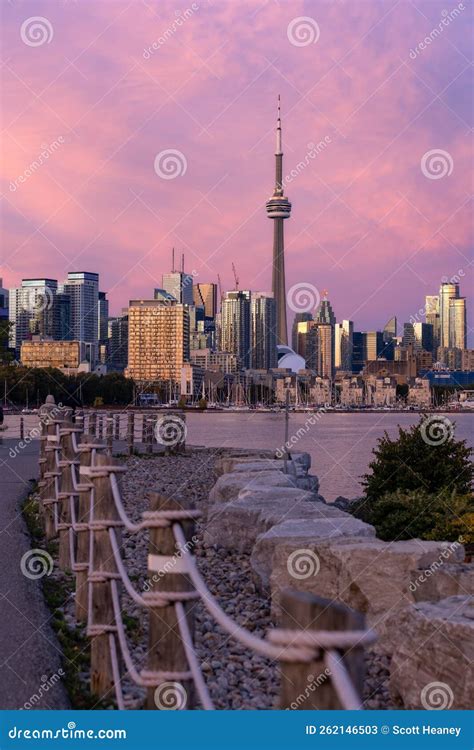 Waterfront Path Leading To A Colorful Pink Sunset Above The Toronto