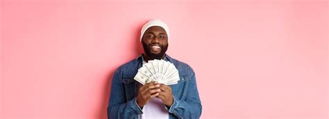 Free Photo Handsome Bearded Africanamerican Man Showing Money Earning