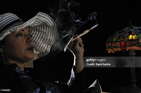 Mature Woman Smoking With Cigarette Holder High Res Stock Photo Getty