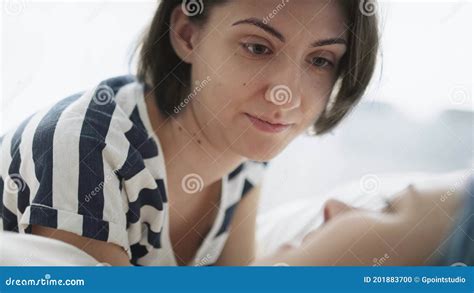 Close Up Handheld Video Of Lesbian Couple Talking In Bed Stock Footage