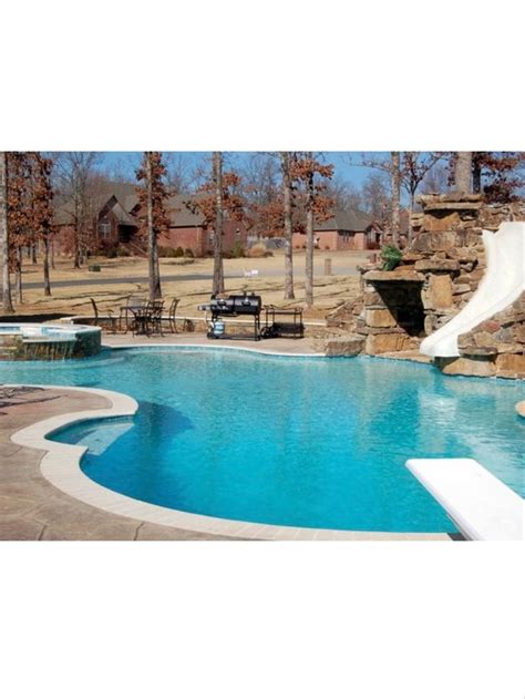 Pool with spa, slide and diving board. | Pool contractors, Custom swimming pool, Pool