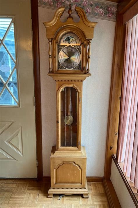 Colonial Of Zeeland Grandmother Clock And Regulator Wall Clock In 2022