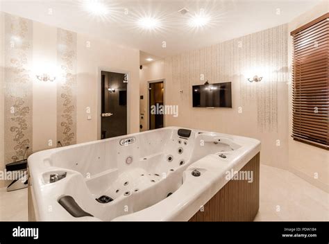 Interior of modern bathroom with jacuzzi Stock Photo - Alamy