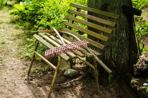 Old Metal and Wooden Cemetery Bench with Rakes on it Stock Photo ...