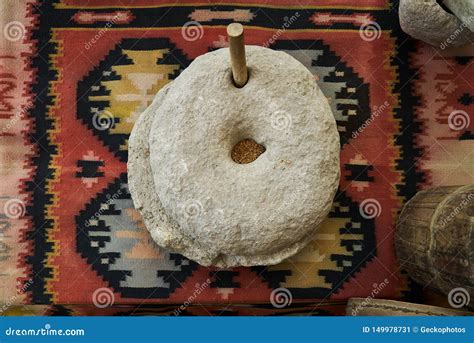 The Ancient Quern Stone Hand Mill With Grain Close Up Stock Image