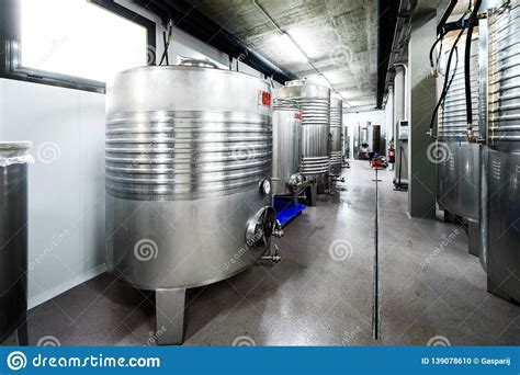 Inox Wine Barrels Stacked In Modern Winery Cellar In Spain Stock Photo