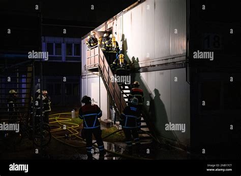 Hamburg, Germany. 13th Feb, 2023. Firefighters work on the container ...