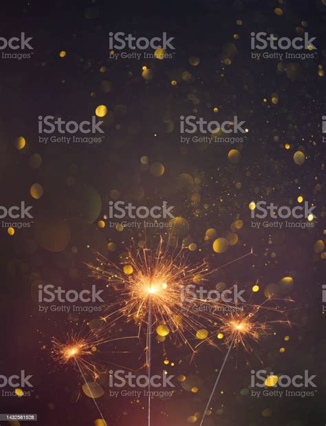 Happy New Year Sparklers Burning Bright With Shiny Sparks And Bokeh