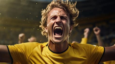 Premium Photo Jubilant Soccer Player In Yellow Experiencing Victory