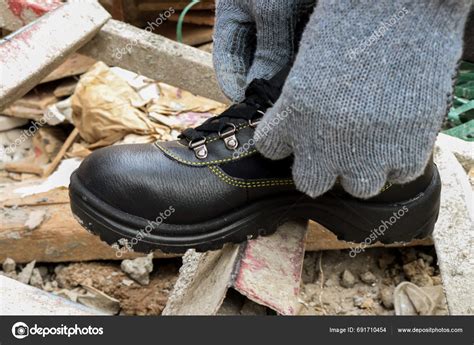 Photo Construction Worker Wearing Black Leather Safety Shoes Work Protect Stock Photo by ©NUR ...