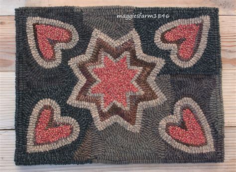 A Close Up Of A Rug On A Wooden Floor With Hearts And Stars In The Middle