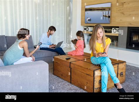 Family using electronics gadgets Stock Photo - Alamy