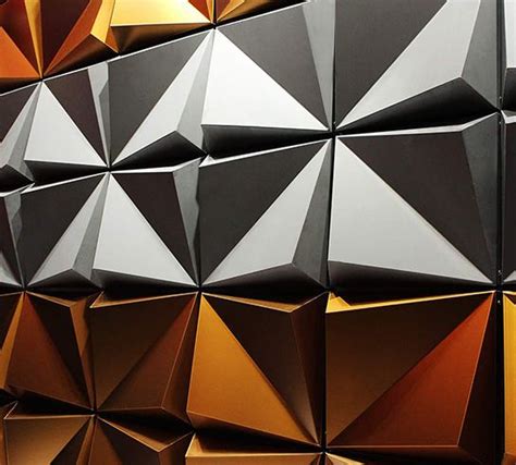 An Abstract Wall Made Up Of Black Gold And White Shapes With One Corner Missing